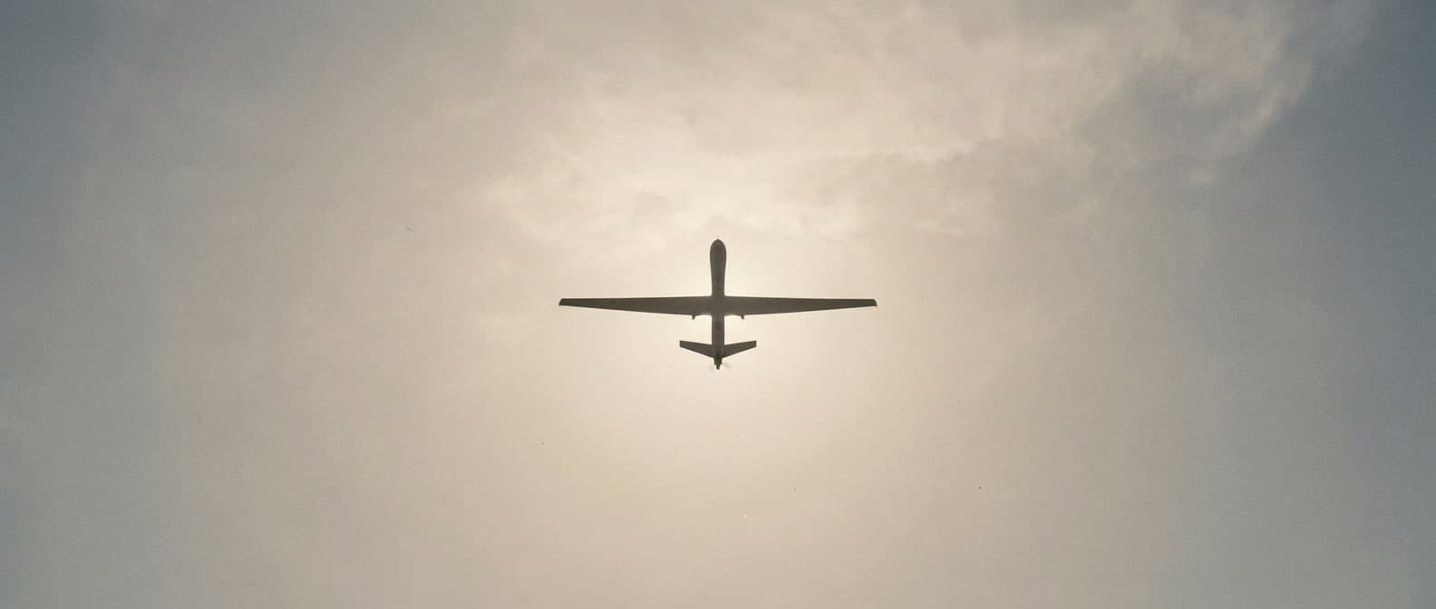 Drone silhouette against sky